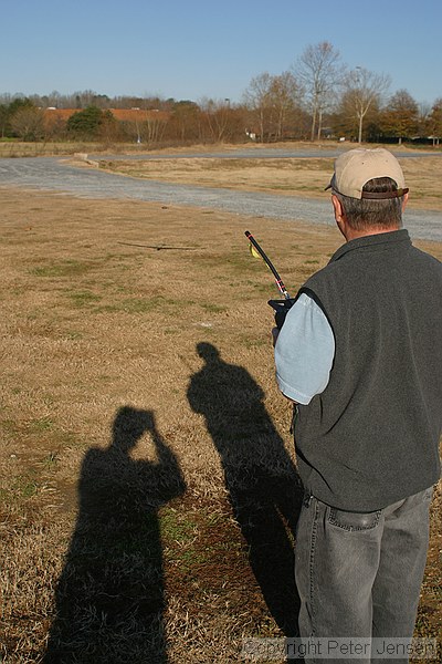 the shadow is much easier to see than Buddy's plane, but both are there