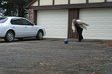 Paul demonstrates lawn bowling at 911 Jeff Davis