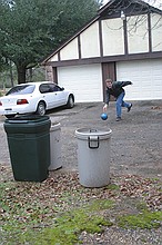 Peter demonstrating lawn bowling at 911 Jeff Davis