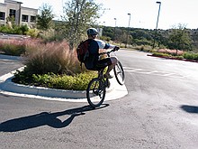 Steve pulling some wheelies and pogo-hops