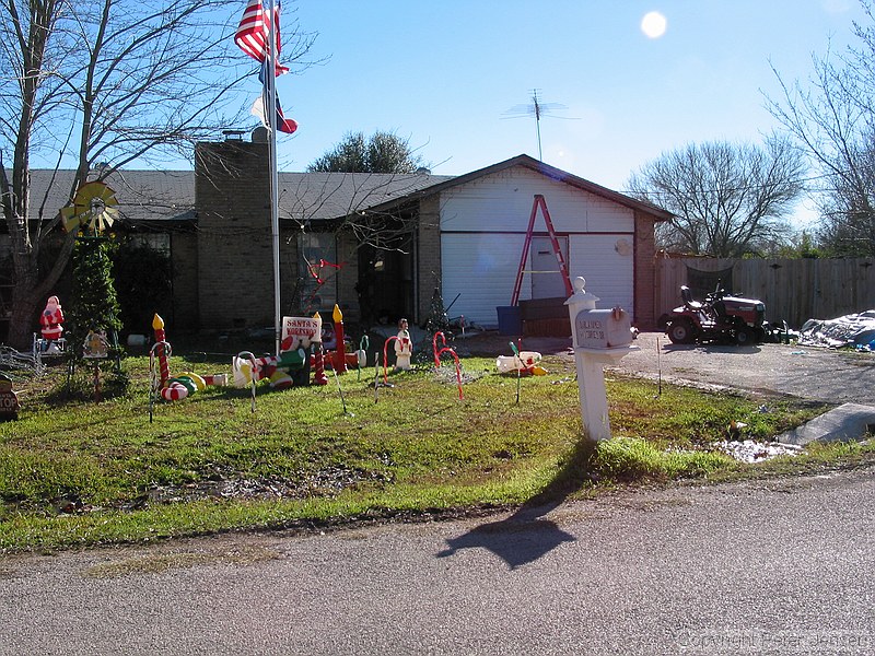 Christmas season disguises some of the junk in the yard here, but this house is always a POS dump