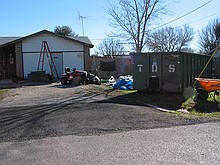 Christmas season disguises some of the junk in the yard here, but this house is always a POS dump