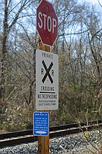 sign near the tracks