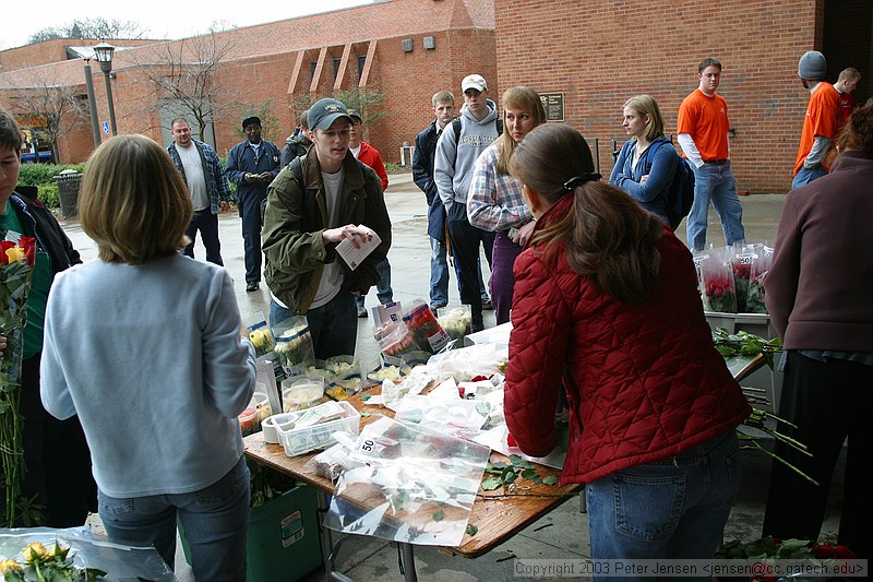 random people buying roses on Valentine's day