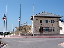 flags at half staff at the Pflugerville Justice Center