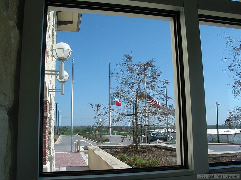 flags at half staff at the Pflugerville Justice Center