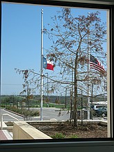 flags at half staff at the Pflugerville Justice Center