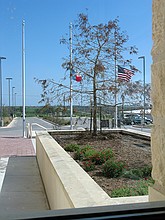 flags at half staff at the Pflugerville Justice Center