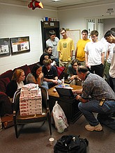 Stanley Leary giving the student publications photography staff a talk about his approach to photojournalism