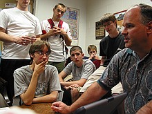 Stanley Leary giving the student publications photography staff a talk about his approach to photojournalism