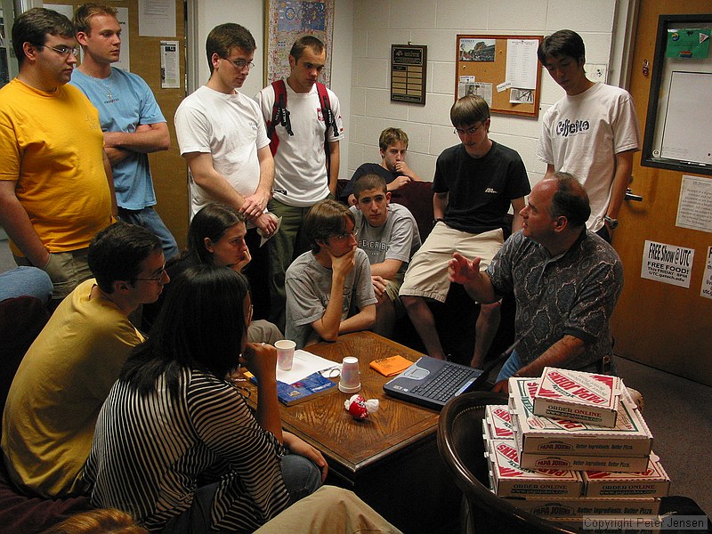 Stanley Leary giving the student publications photography staff a talk about his approach to photojournalism