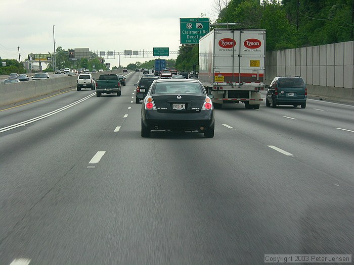 note the right exhaust pipe on this Altima