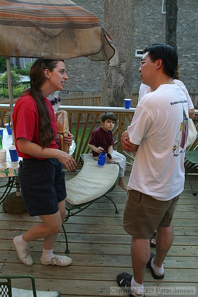 Meghan and Khai talk on the patio