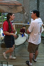 Meghan and Khai talk on the patio