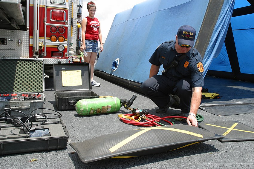 a fireman kindly demonstrated one of their heavy lifting bags to me -- an airbag similar to this one can be shoved under a fallen piece of comcrete (or structure) and can lift huge amounts.  This particular bag is rated for a maximum of 34.7 tons, which i