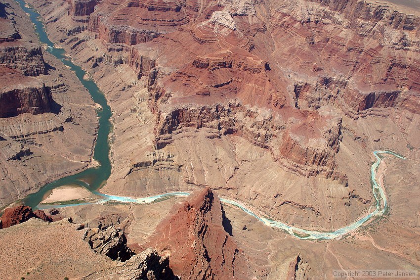 if you look closely here, there appear to be two large rafts docked on the shore in the middle-left of this image, on the far bank of the smaller waterway that's horizontal