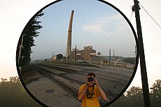 me taking silly pictures of GA Power Plant Arkwright's 582' stack, one week before it will be demolished