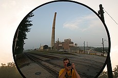 me taking silly pictures of GA Power Plant Arkwright's 582' stack, one week before it will be demolished