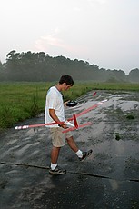 Charles tries to avoid sinking into the runway/swamp