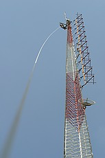 Micky Blackmon of Blackmon Site Services (recommended) preparing to mount the 2m antenna on to the new side arm mount