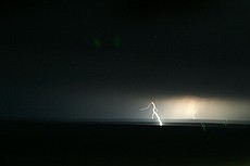 the drive from ABQ to Amarillo was awesome -- major thunderstorms were to our south and northeast, but we never got more than a few drops of rain.  This image is a long exposure taken handheld from a Ford Escape going ~70mph down the road at night.