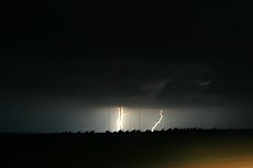 the drive from ABQ to Amarillo was awesome -- major thunderstorms were to our south and northeast, but we never got more than a few drops of rain.  This image is a long exposure taken handheld from a Ford Escape going ~70mph down the road at night.