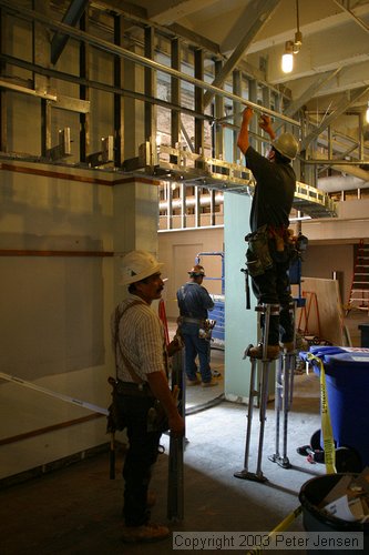 workers building part of the new post office