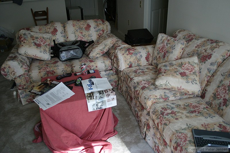 ghetto cardboard box-and-sheet coffee table, couches