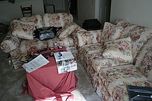 ghetto cardboard box-and-sheet coffee table, couches