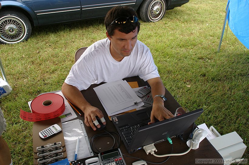 Oleg entering scores into the computer (powered by a deep cycle and 400 watt inverter)