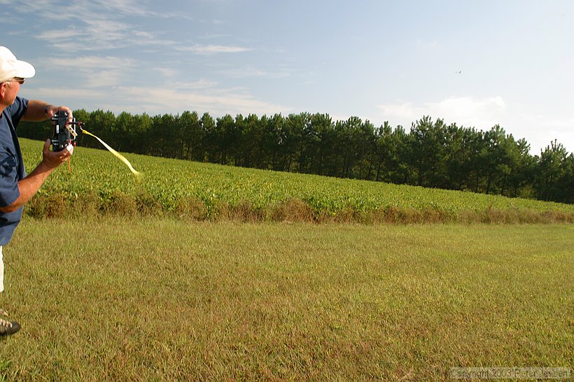 Buddy working some lift low over the trees