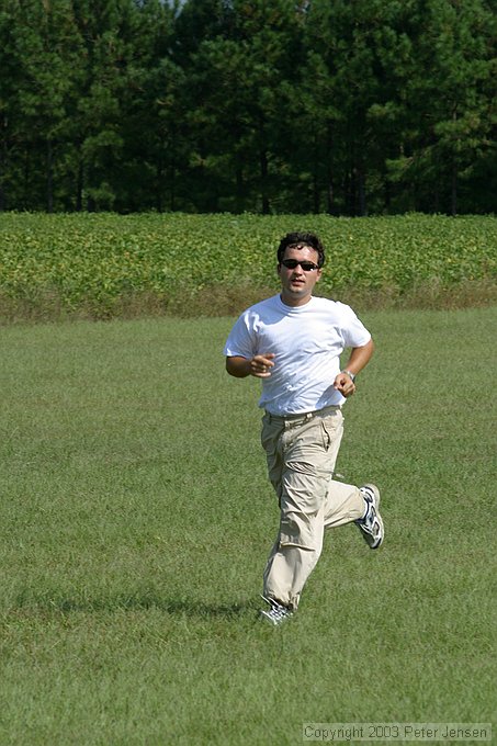 Oleg runs to get his plane before the round starts