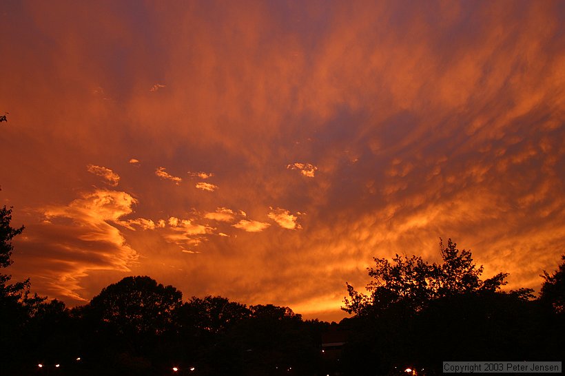 this was an absolutely beautiful sunset that only lasted for a few minutes.  I thought the sun was already gone when this came up about ten minutes later; the high altitude cloud layer really did well.   No saturation enhancement has been done.