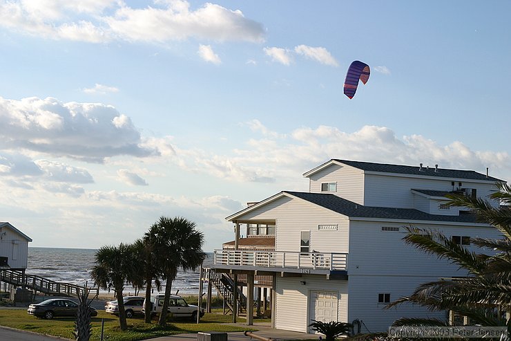 kiteboarder on the beach, as viewed from the deck