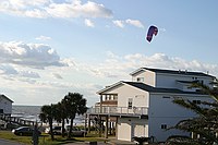 kiteboarder on the beach, as viewed from the deck