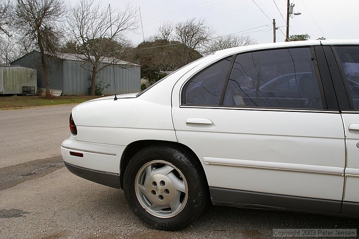 note the paint on the wheel.  We re-did most of that quarter panel and a lot of the intersection with the top of the door