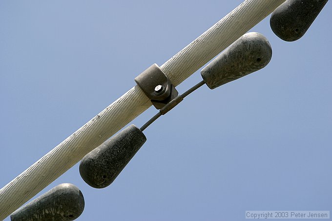 close-up of lead mass balance on the guy wires