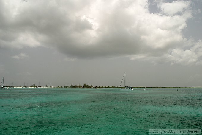 boats moored in the Anegada harbor near the Anegada Reef Hotel.  Dark spots in the water are a combination of sea grass and clouds, but the average depth is something like 6 to 8 feet here.