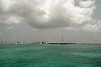 boats moored in the Anegada harbor near the Anegada Reef Hotel.  Dark spots in the water are a combination of sea grass and clouds, but the average depth is something like 6 to 8 feet here.