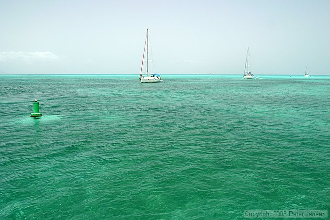 boats entering the semi-marked channel (note the really shallow spots off in the distance past the channel)