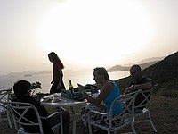 cool family having wine at sunset on Peter Island that we briefly visited with