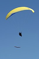 looks close, but I was a bit higher than the pilot and am using a telephoto lens; he maintained visual separation the whole time and the lateral separation is pretty large