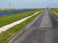 a typical view of the paved portion of the trail.  Pavement quality was excellent, although grass was starting to break things up in some areas.