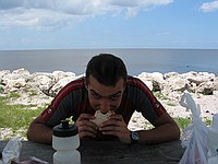 Jacob vs. peanut butter sandwich with 15-20 miles of lake in the background