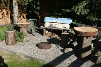 cool sitting area made from snowboards and logs