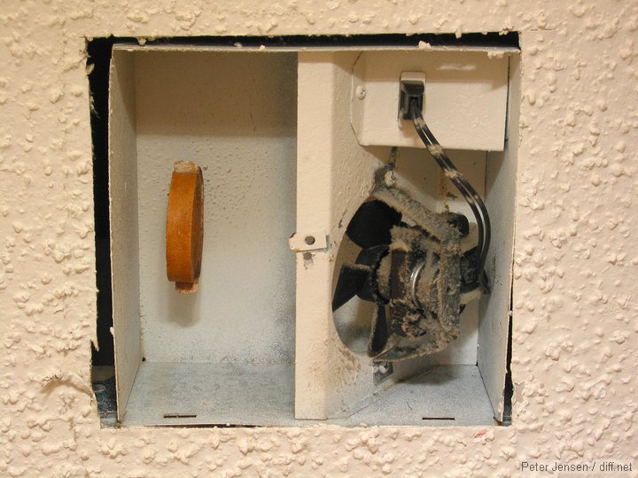 a fan blows through the urinal cake