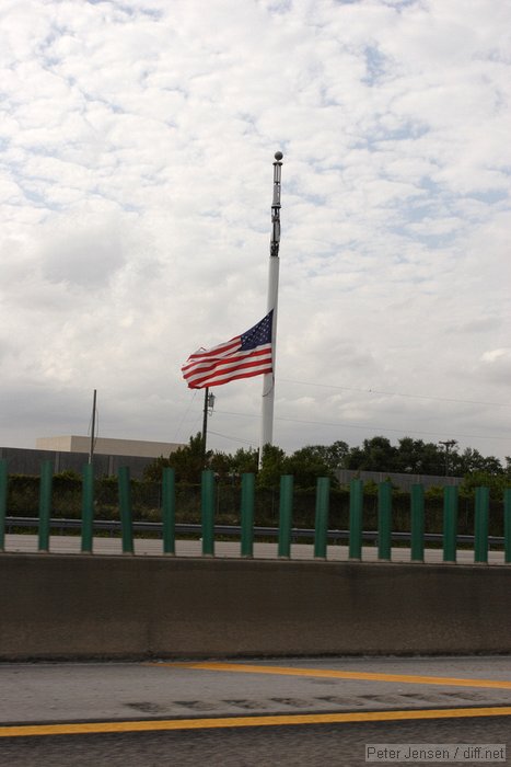 the flag is at half mast because cell sites on flagpoles is just wrong