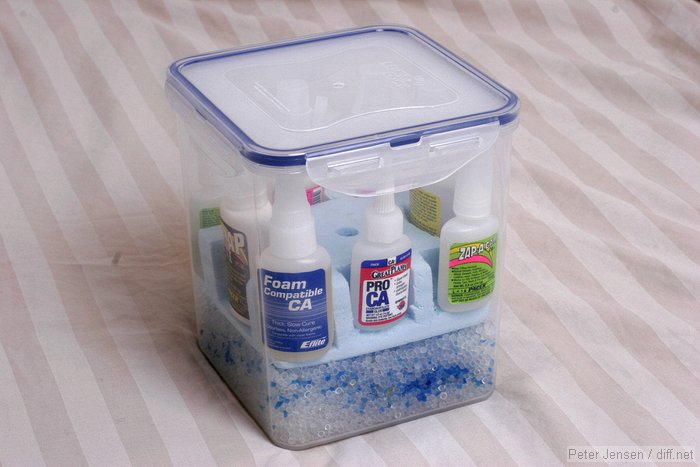 the sealed container, with silica gel and some blue-when-dry pink-when-full markers