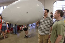 autonomous inflatable robot being playful with shoppers