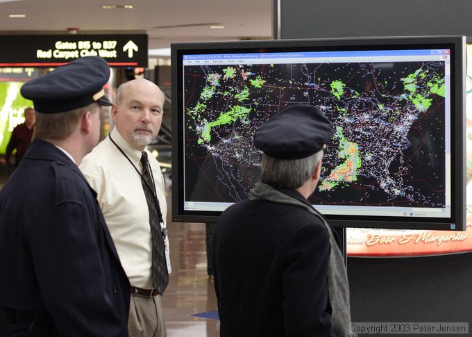 nice FAA guys doing PR in the Denver airport showing weather superimposed on IFR traffic